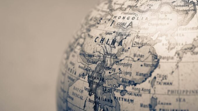 Old vintage globe focused on China
